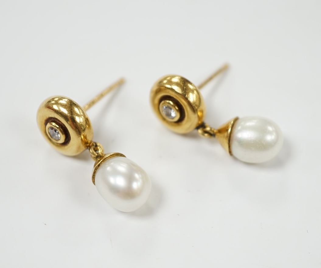 A modern pair of Boodles & Dunthorne 18ct gold, single stone cultured pearl and single stone diamond set drop earrings, lacking butterflies, 21mm, gross weight 5.1 grams. Condition - fair